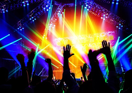 Silhouetted hands at a pop concert